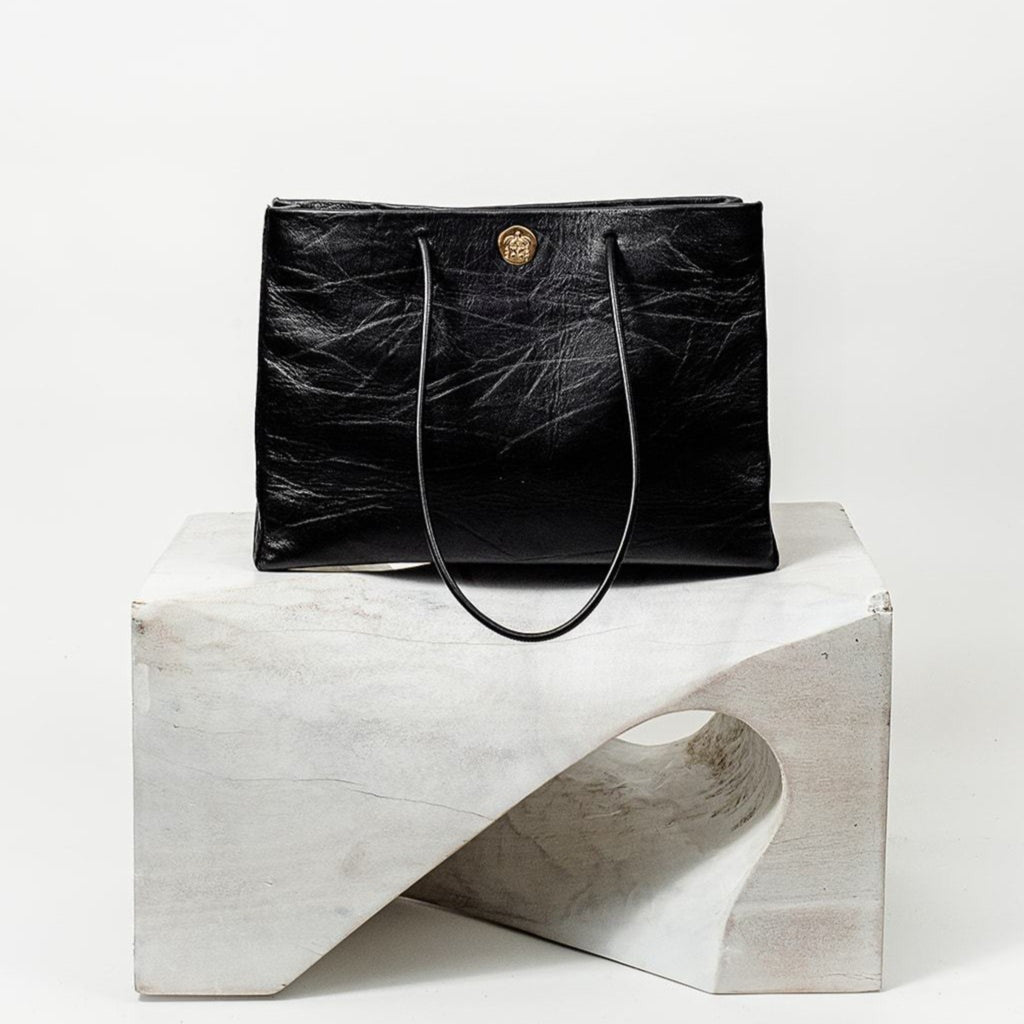 Gabi Handbag | Made with creased cowhide leather and adorned with our solid brass Kheloni coin.