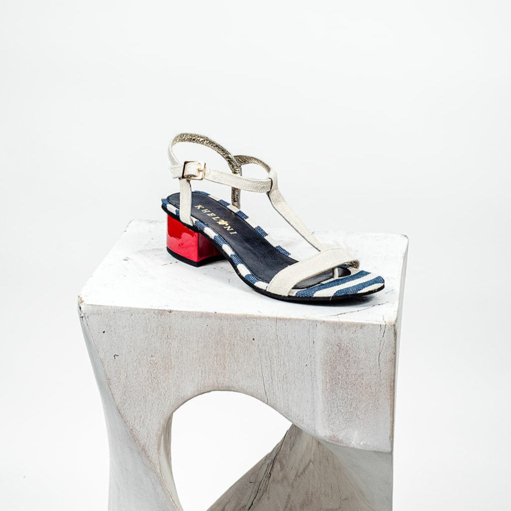 Handmade Greek sandal with blue and white linen and a fire red heel.