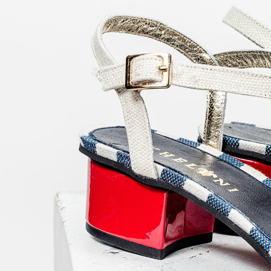Handmade Greek sandal with blue and white linen and a fire red heel.