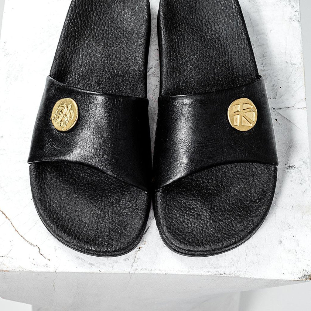 Pisina means "Pool" | Black handmade leather vibram resort slide with gold coinage and brass accents.