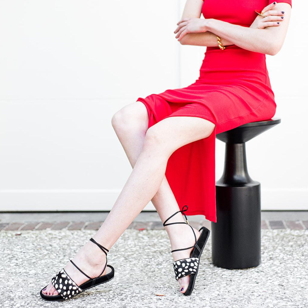 Woman wearing Rebekah | Sandal with rich black velvet and ivory spotted printed cowhide.