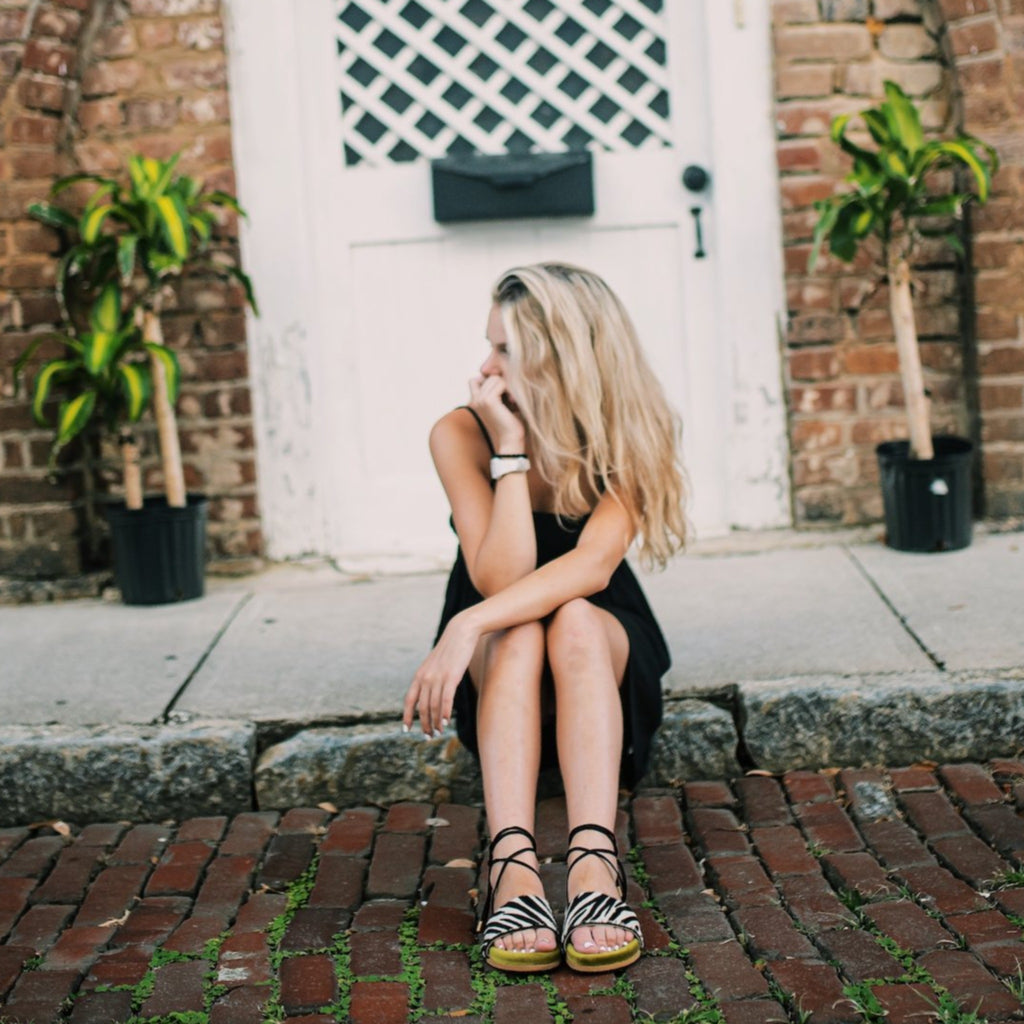 Woman wearing Nita - Handmade Greek Sandal with green velvet and zebra print.