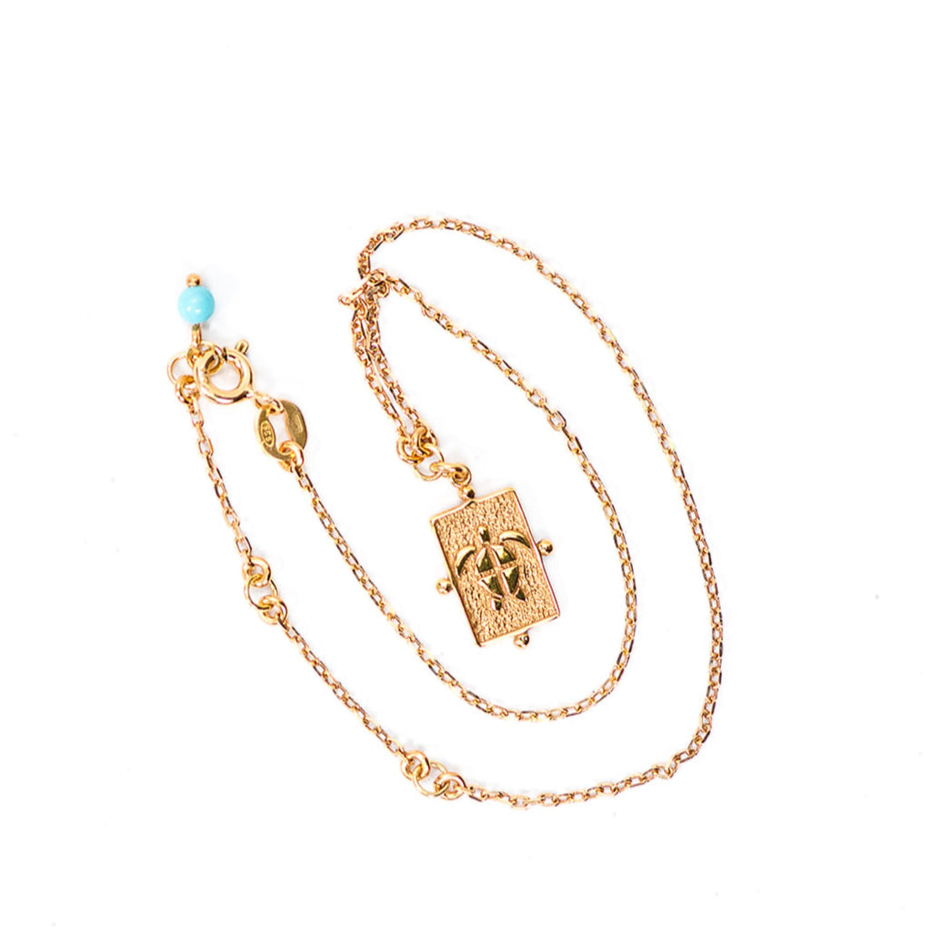 Gold 24K  anklet with turtle charm and turquoise adornment. 